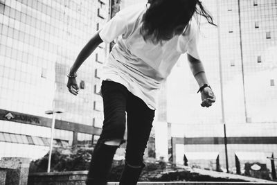 Woman standing with umbrella