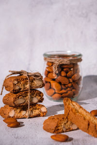 Traditional italian cantuccini cookies with almonds in glass jar. sweet dried biscuits. homemade 