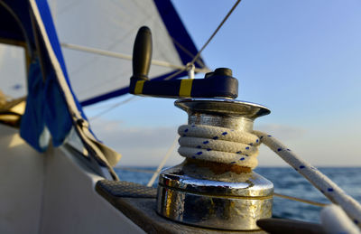 Close-up of sailboat in sea against sky