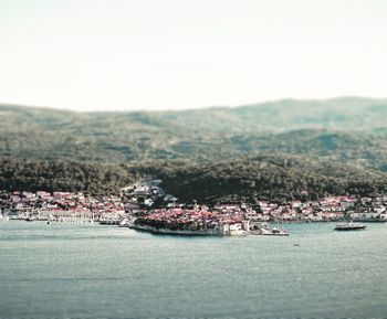 Scenic view of lake and mountains in town