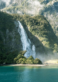 Scenic view of sea against mountain