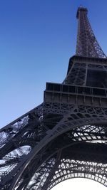 Low angle view of tower against blue sky