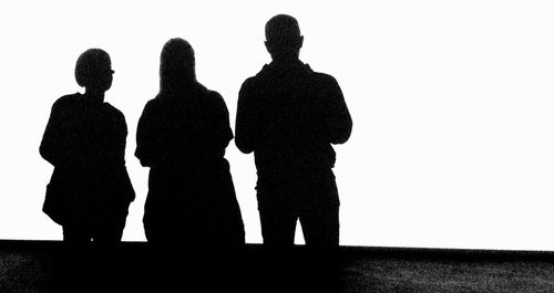 Silhouette people against white background