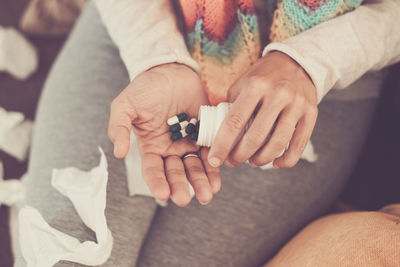 Midsection of woman holding hands