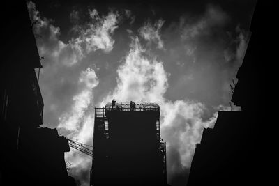 Low angle view of built structure against cloudy sky