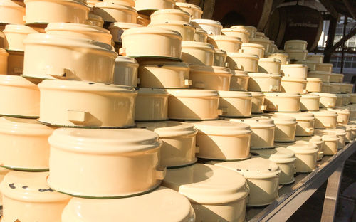 Close-up of stacked containers for sale at market stall