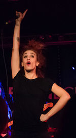 Portrait of young woman in music concert