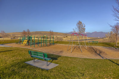 Scenic view of playground against sky
