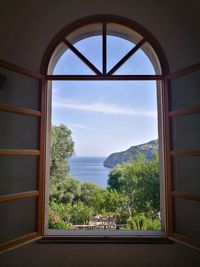 Scenic view of sea seen through window