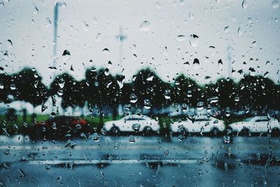 Full frame shot of wet glass window in rainy season