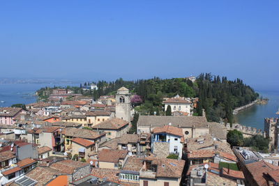 High angle shot of townscape against clear blue sky