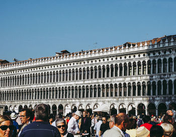 Group of people in front of historical building