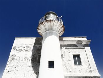 Low angle view of building against blue sky