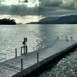 Scenic view of sea against cloudy sky