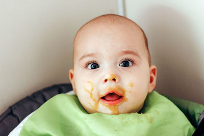 Feeding the baby. sweet infant with dirty face