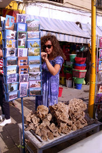 Full length of man standing at market stall