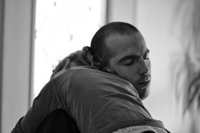 Close-up of young man looking away