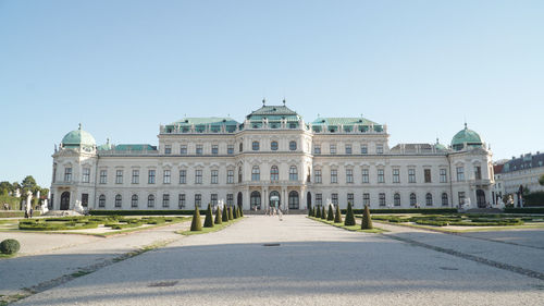 Facade of historic building against clear sky