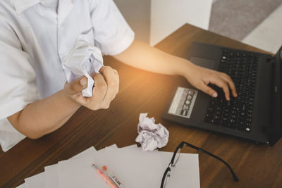 Man using laptop on table