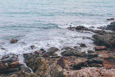 Scenic view of sea waves splashing on rocks