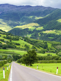 Scenic view of country road amidst landscape