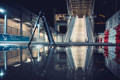 Illuminated bridge against sky at night