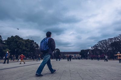 People at cloudy sky