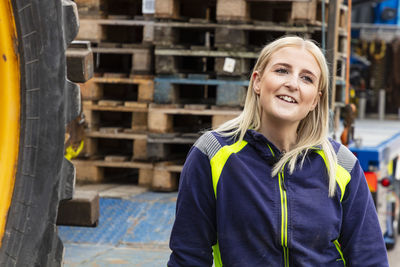 Woman working with construction vehicle