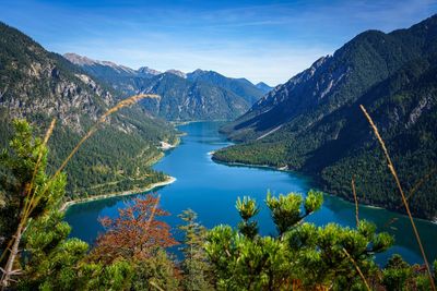 Scenic view of lake and mountains against sky