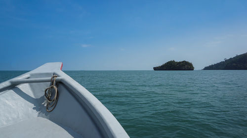 Close-up of boat in sea against sky