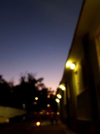 Defocused image of illuminated street at night