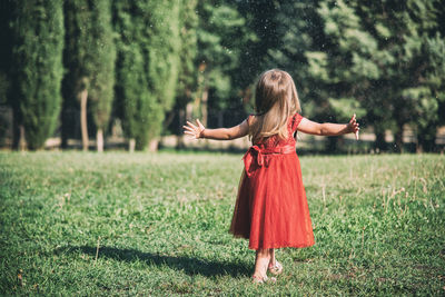 Full length of woman standing on field