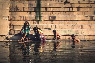 People sitting in water