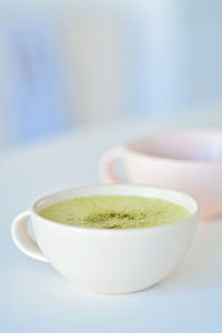 Close-up of coffee cup on table