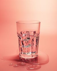 Close-up of drink in glass against white background