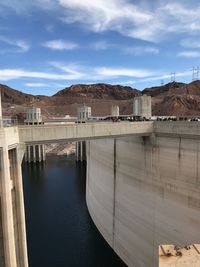 View of dam against cloudy sky