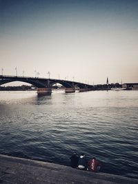 Bridge over river against clear sky