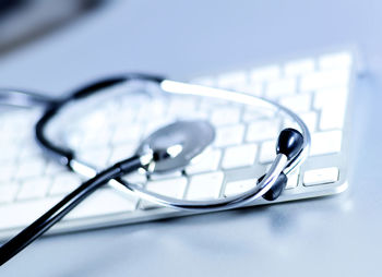 High angle view of stethoscope on computer keyboard