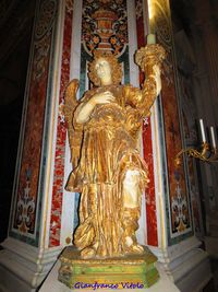 Statue in temple outside building