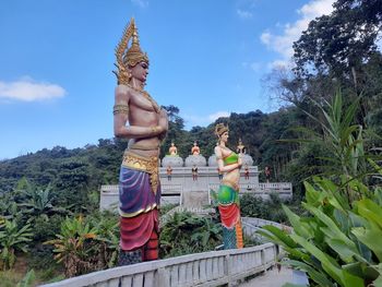 Statue of buddha against sky