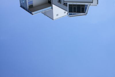 Low angle view of built structure against clear blue sky