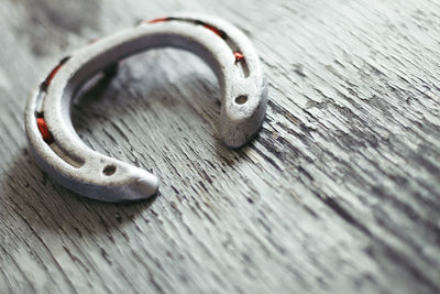 High angle view of horseshoe on table