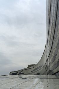 Low angle view of airport runway against sky