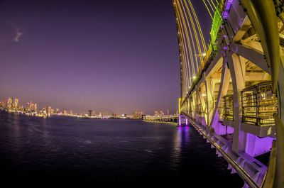 Bridge over river at night