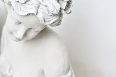 Close-up of statue against white background