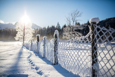 Snow covered landscape against sky