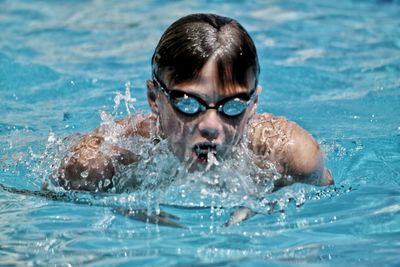 Two people swimming in water