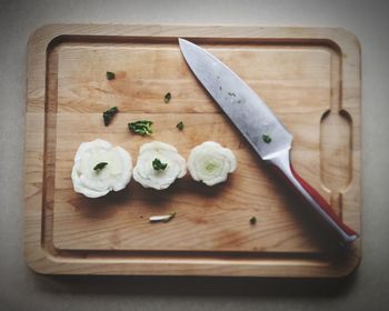 High angle view of chopped bread on cutting board