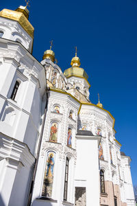 Low angle view of building against blue sky