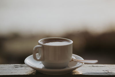 Close-up of coffee cup on table